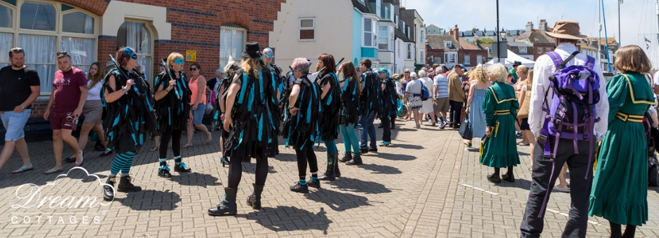 Wessex Folk Festival dancers along the harbour in Weymouth