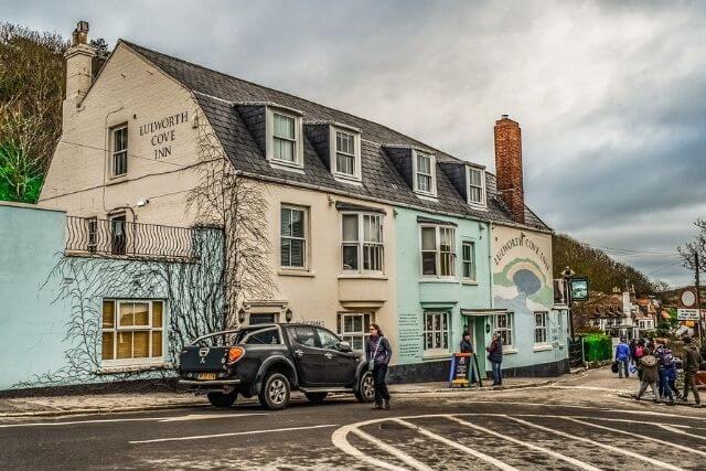 Lulworth Cove Inn with customers outside