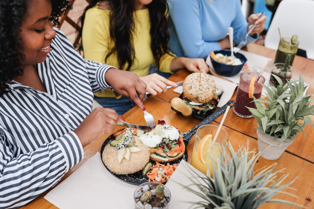 friends tucking into vegan food in Bournemouth