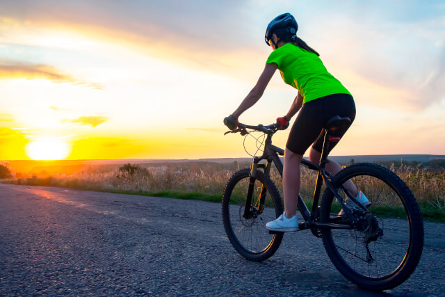 Cyclist with sunset in background